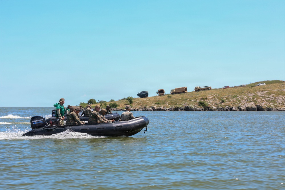 U.S. Marines and Romanian forces conduct combat rubber raiding craft operations in Romania