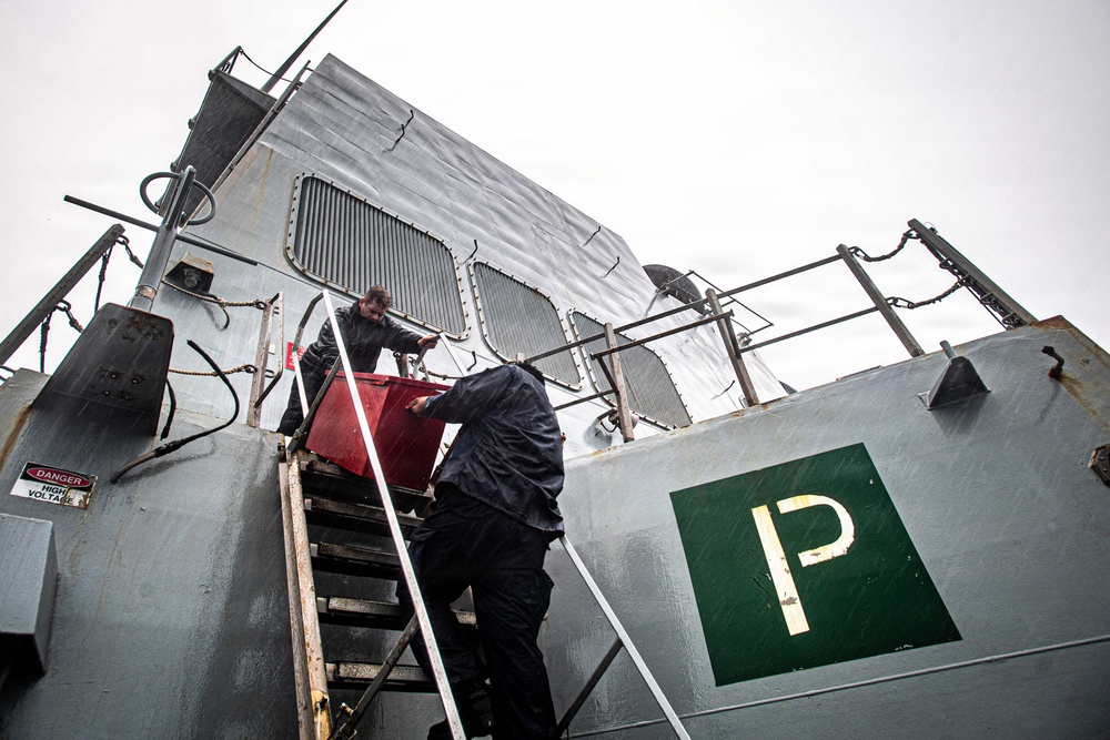 Gridley Sailors Haul Cargo in the Rain