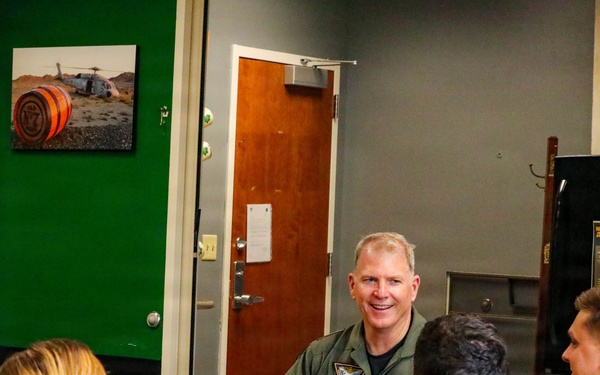 Rear Adm. Rich Brophy speaks with officers assigned HSC-7