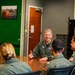 Rear Adm. Rich Brophy speaks with officers assigned HSC-7