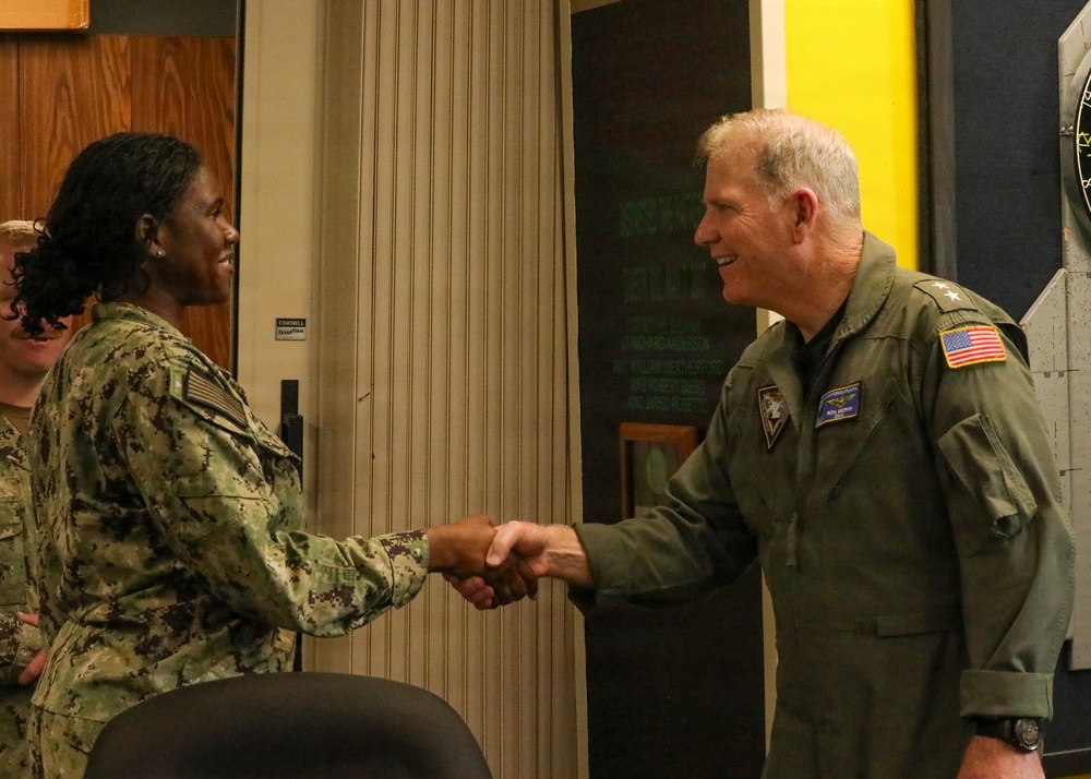 Rear Adm. Rich Brophy recognizes enlisted Sailor assigned HSC-7