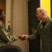 Rear Adm. Rich Brophy recognizes enlisted Sailor assigned HSC-7