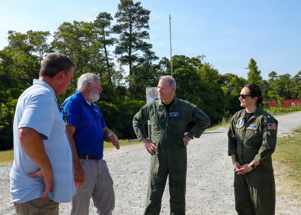Rear Adm. Rich Brophy receives a tour of the Navy Dare Range