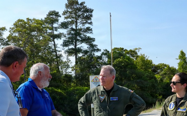 Rear Adm. Rich Brophy receives a tour of the Navy Dare Range