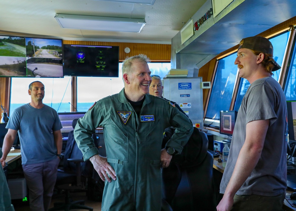 Rear Adm. Rich Brophy receives a tour of the Navy Dare Range