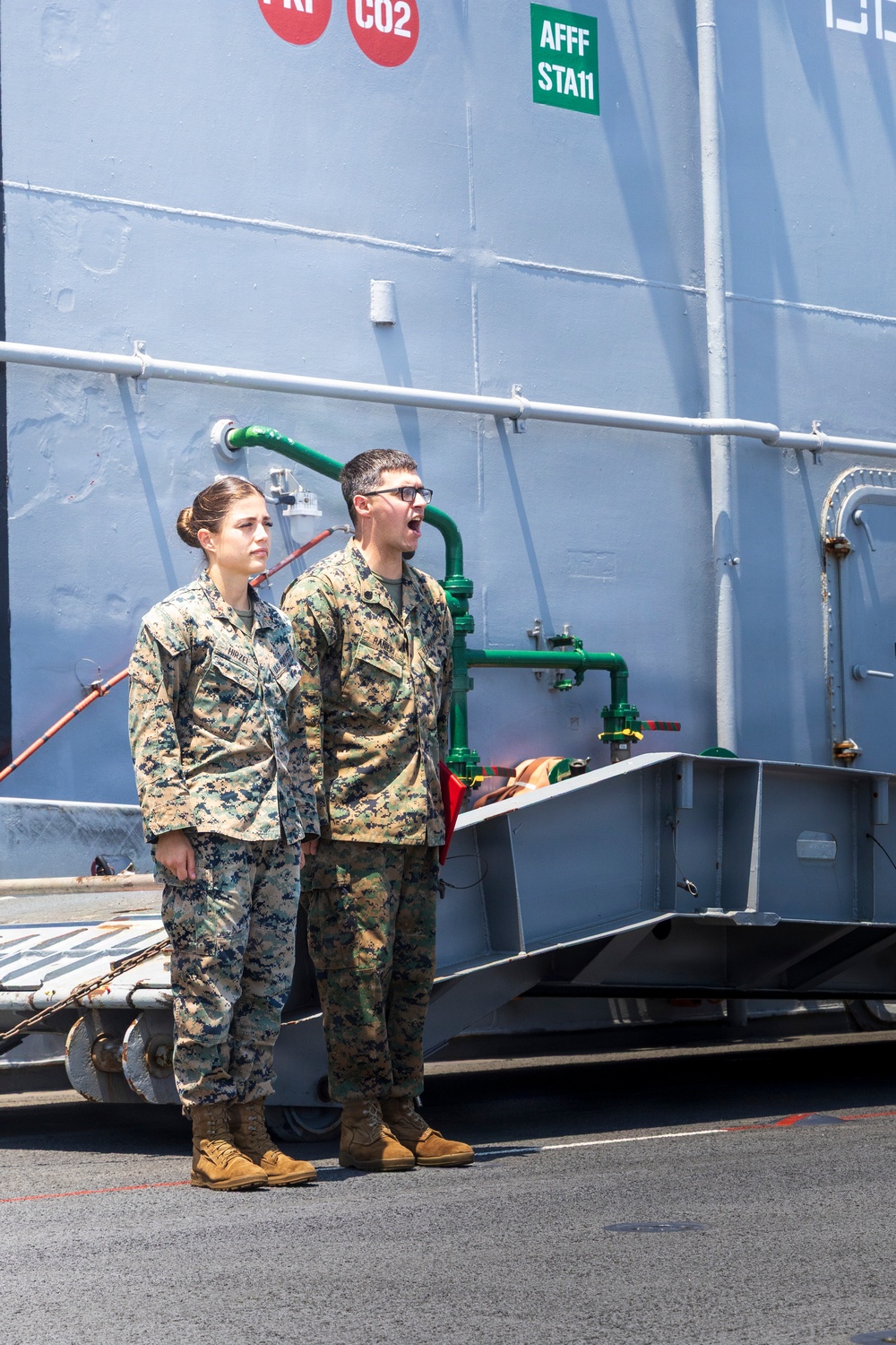 U.S. Marine with the 26th MEU reenlists on the USS Kearsarge