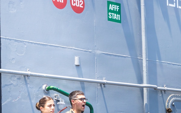 U.S. Marine with the 26th MEU reenlists on the USS Kearsarge