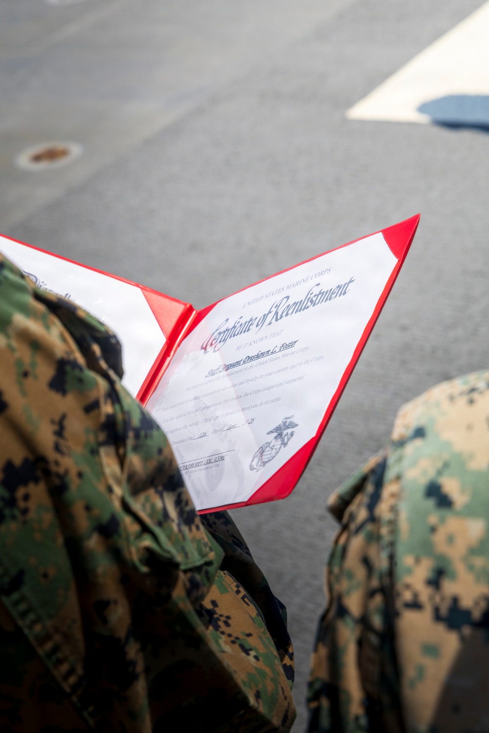 U.S. Marine with the 26th MEU reenlists on the USS Kearsarge