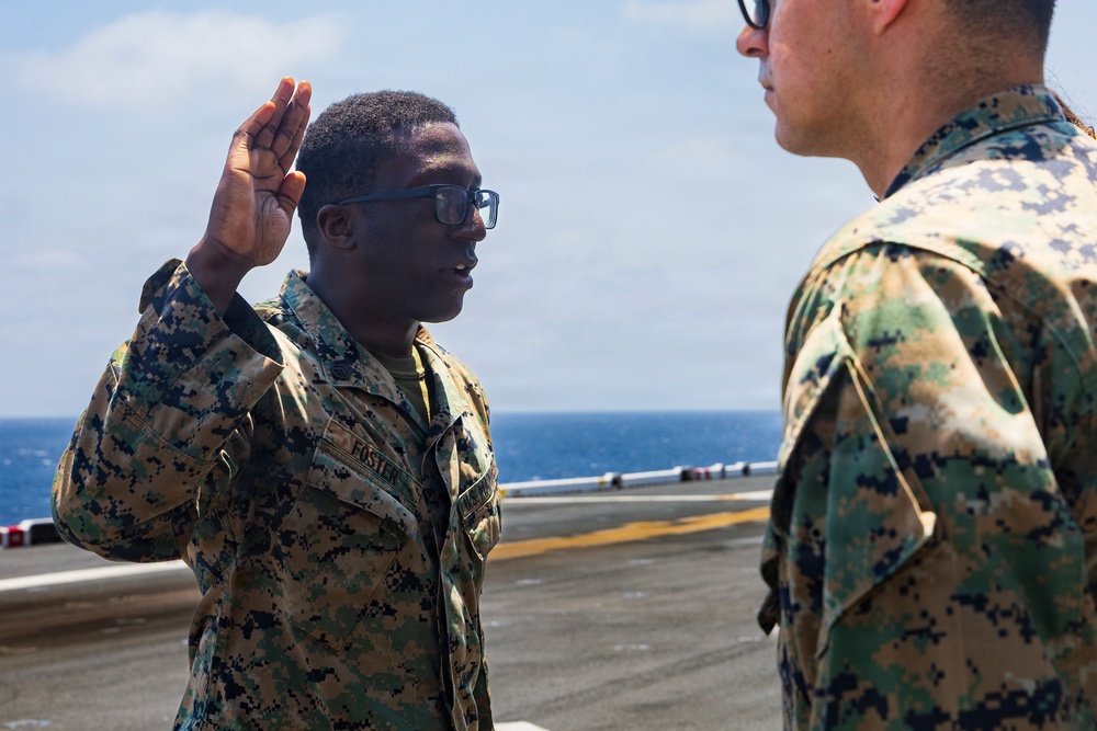 U.S. Marine with the 26th MEU reenlists on the USS Kearsarge