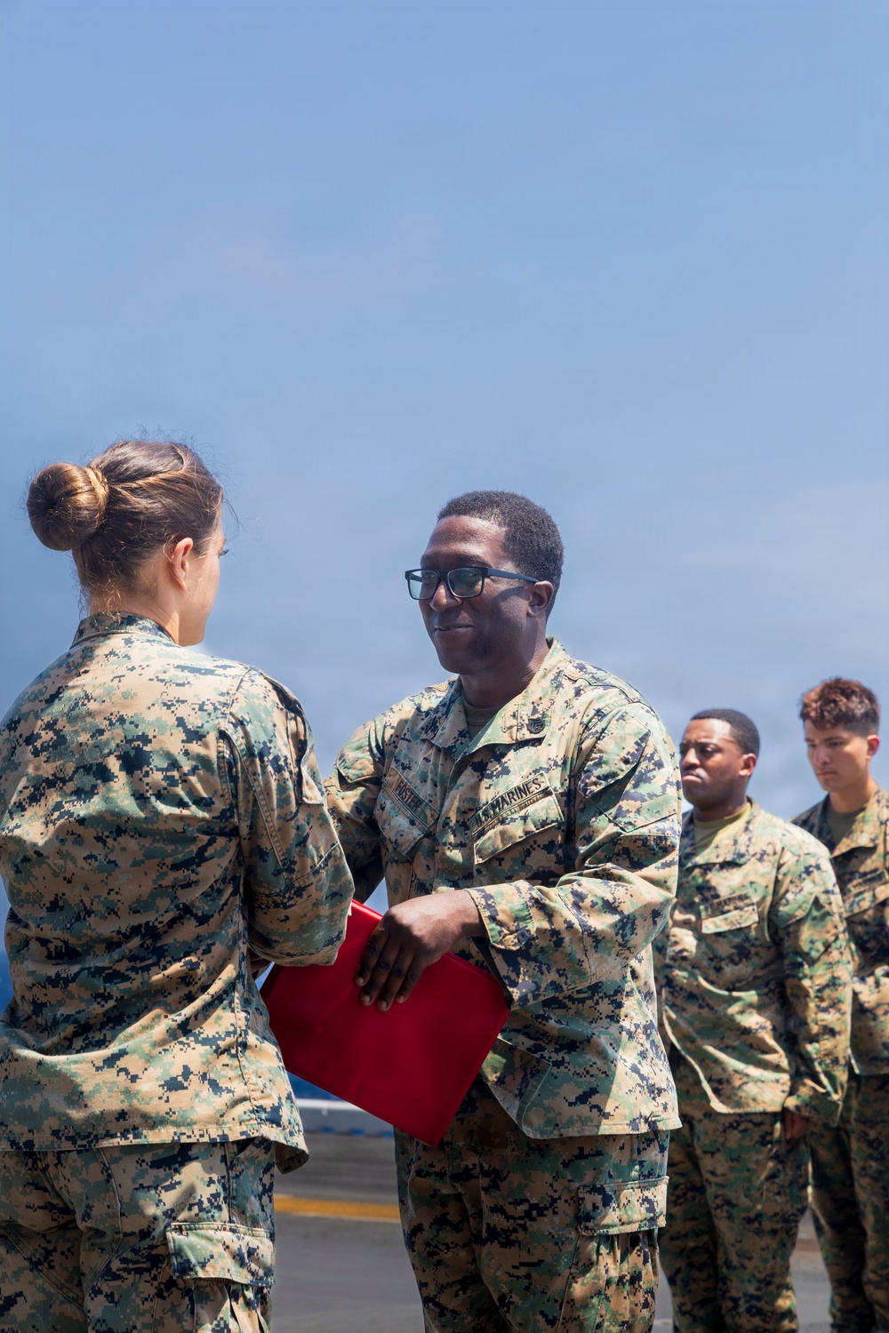 U.S. Marine with the 26th MEU reenlists on the USS Kearsarge