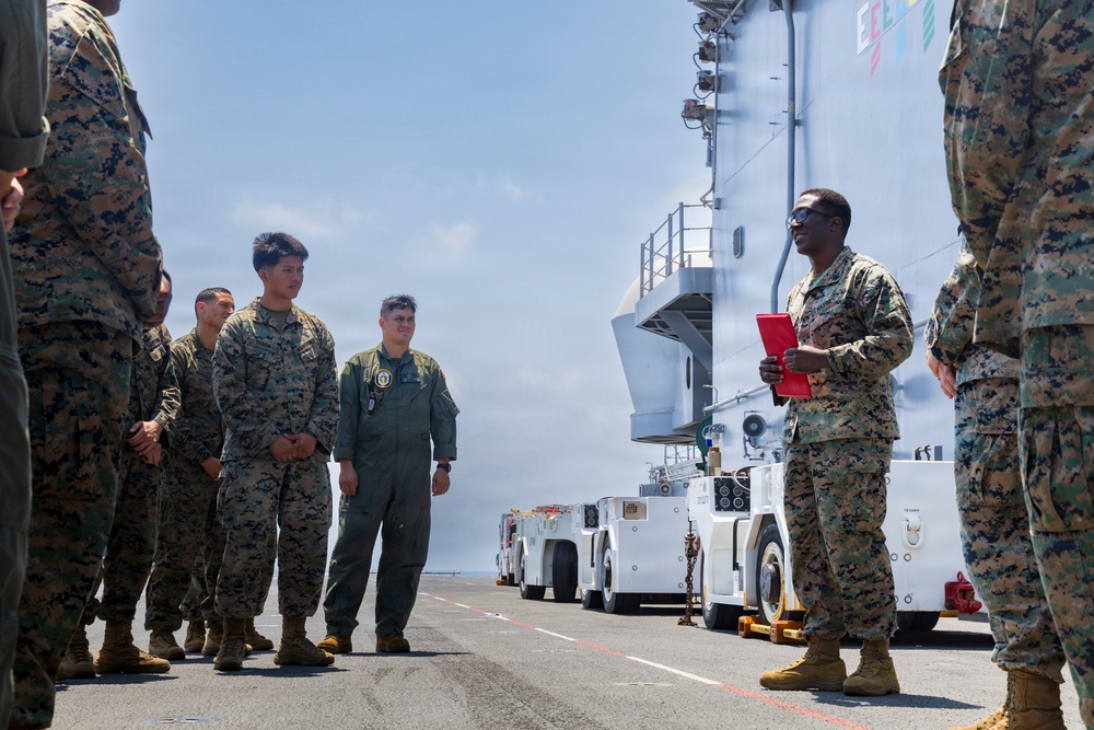 U.S. Marine with the 26th MEU reenlists on the USS Kearsarge