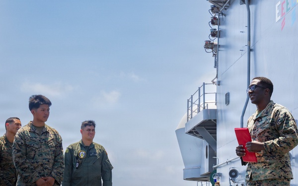 U.S. Marine with the 26th MEU reenlists on the USS Kearsarge