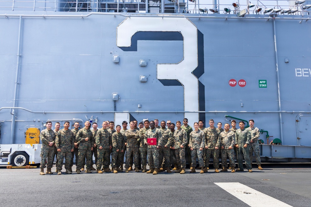 U.S. Marine with the 26th MEU reenlists on the USS Kearsarge