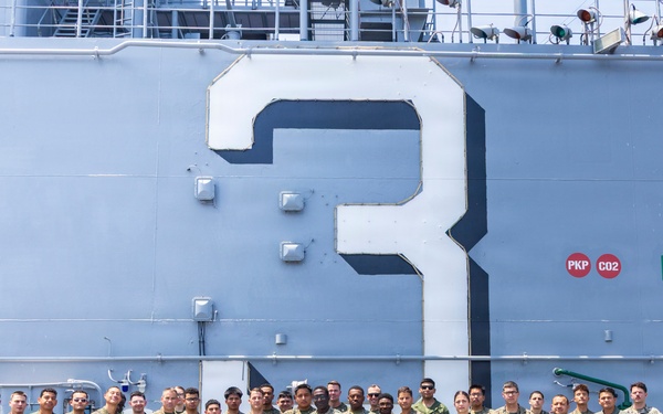 U.S. Marine with the 26th MEU reenlists on the USS Kearsarge