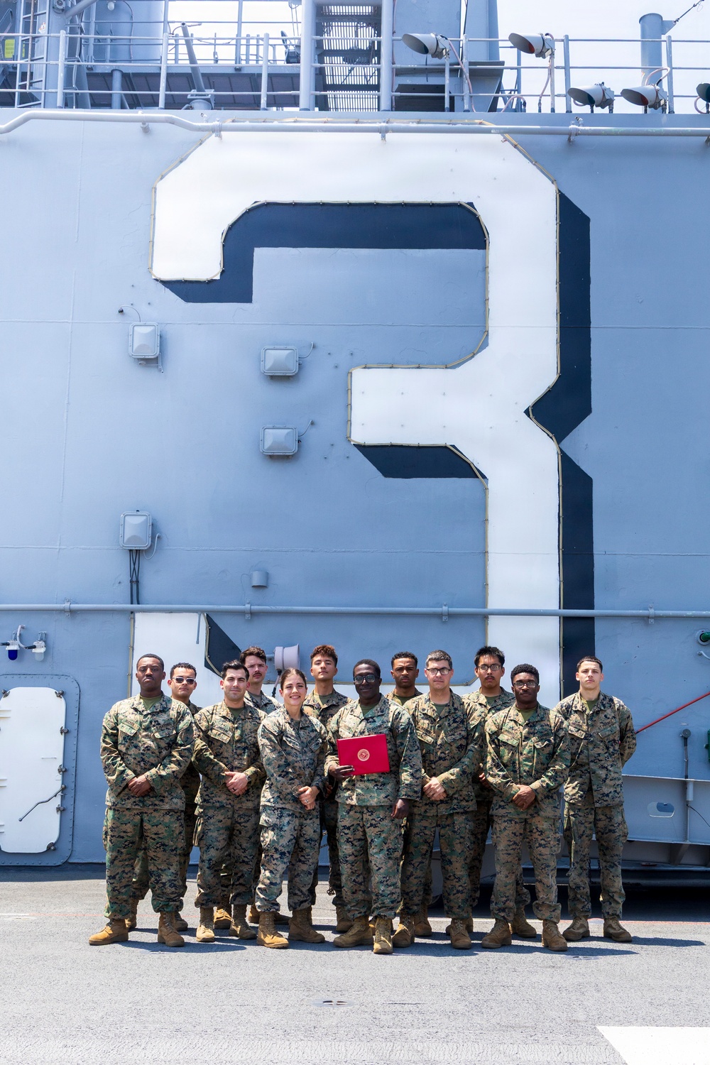 U.S. Marine with the 26th MEU reenlists on the USS Kearsarge