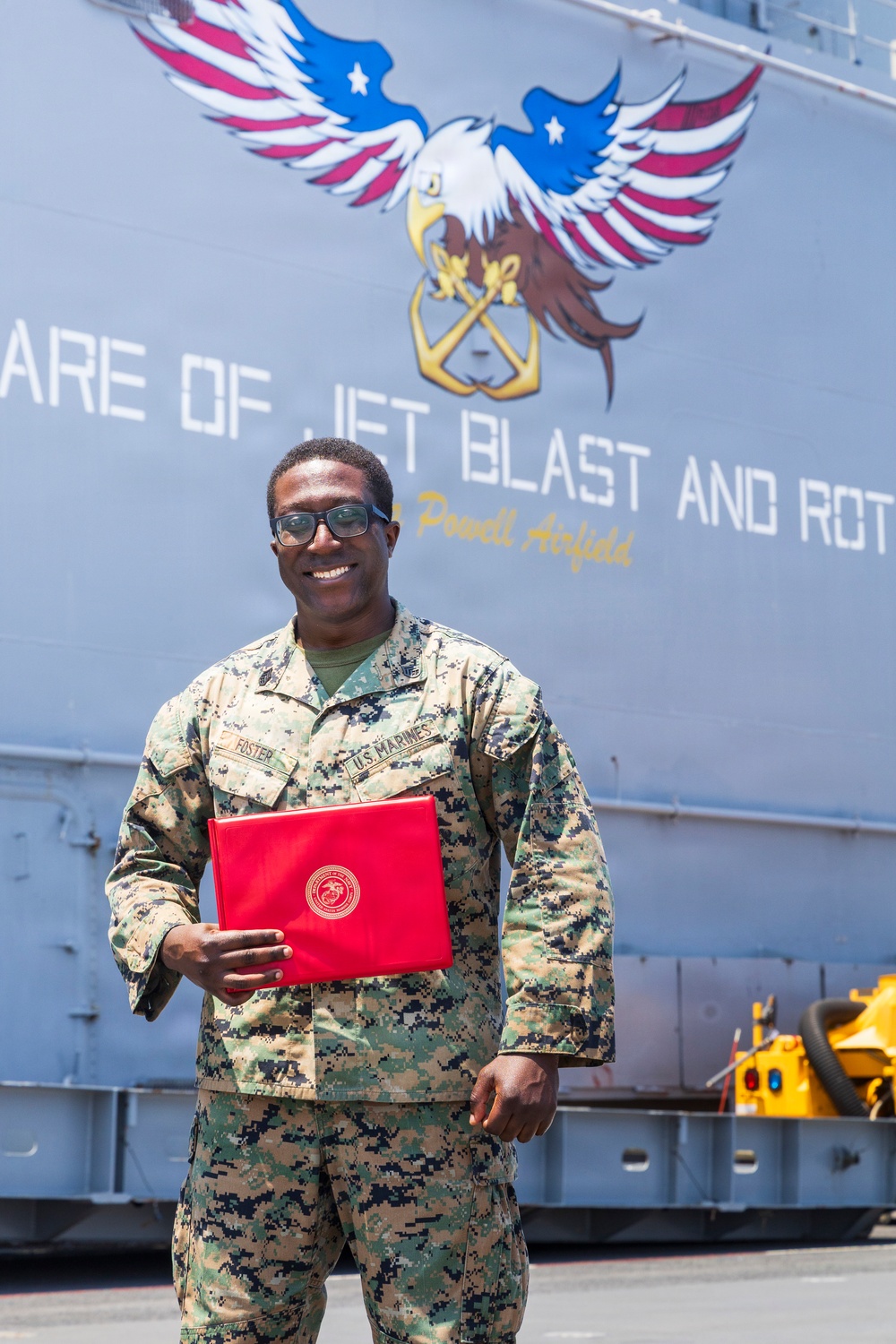 U.S. Marine with the 26th MEU reenlists on the USS Kearsarge