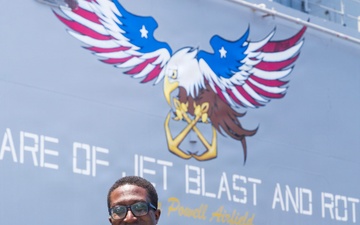 U.S. Marine with the 26th MEU reenlists on the USS Kearsarge