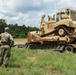 Army Reserve engineers deploy a bulldozer to dig defensive battle positions during Operation Sentinel Justice