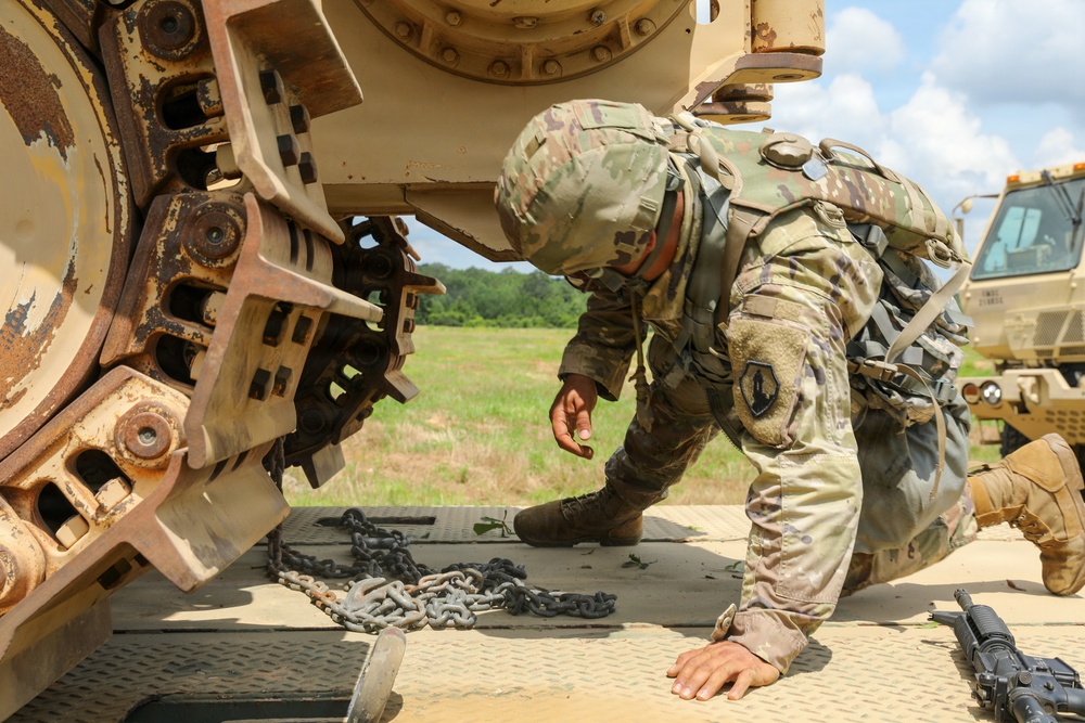 Army Reserve engineers deploy a bulldozer to dig defensive battle positions during Operation Sentinel Justice