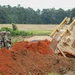 Army Reserve engineers deploy a bulldozer to dig defensive battle positions during Operation Sentinel Justice