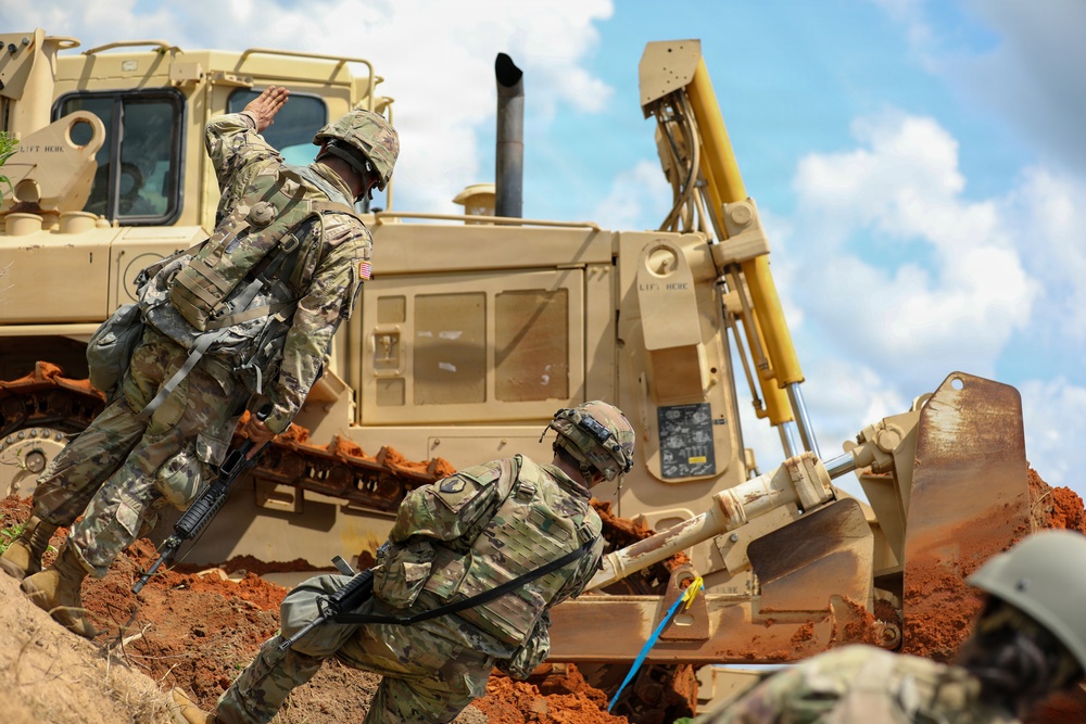 Army Reserve engineers deploy a bulldozer to dig defensive battle positions during Operation Sentinel Justice