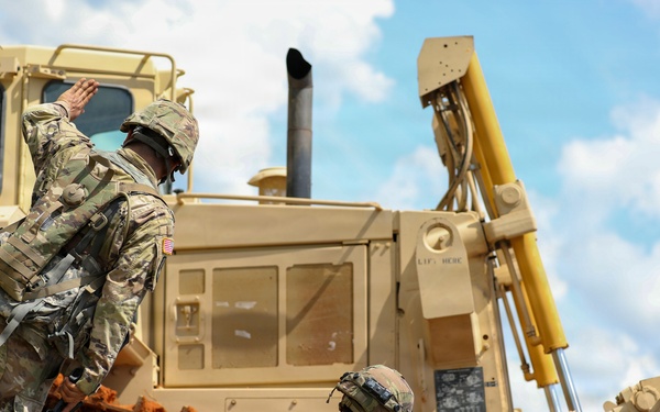 Army Reserve engineers deploy a bulldozer to dig defensive battle positions during Operation Sentinel Justice
