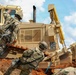 Army Reserve engineers deploy a bulldozer to dig defensive battle positions during Operation Sentinel Justice