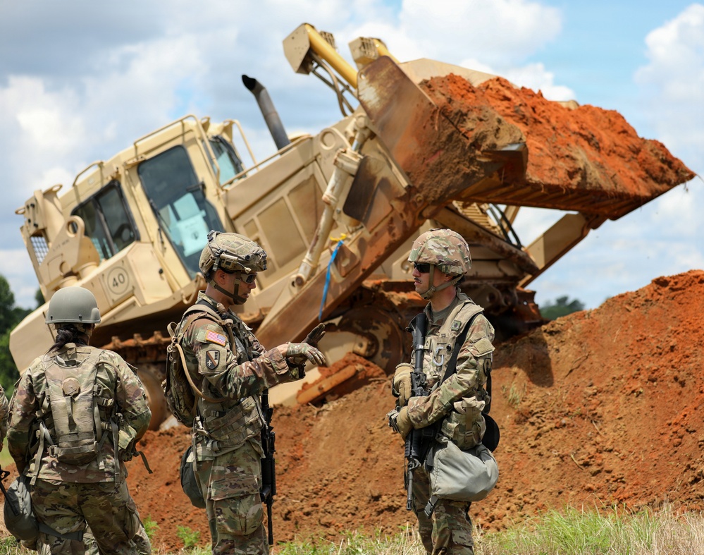Army Reserve engineers deploy a bulldozer to dig defensive battle positions during Operation Sentinel Justice