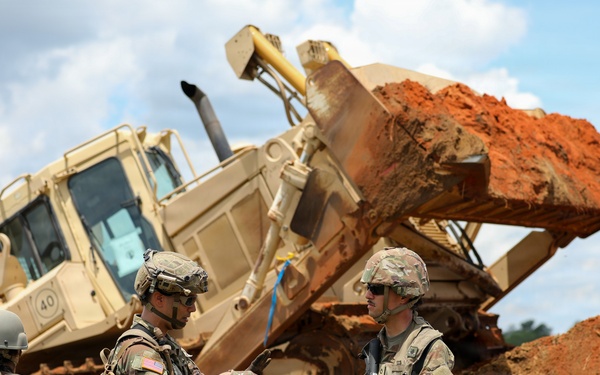 Army Reserve engineers deploy a bulldozer to dig defensive battle positions during Operation Sentinel Justice