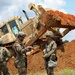 Army Reserve engineers deploy a bulldozer to dig defensive battle positions during Operation Sentinel Justice