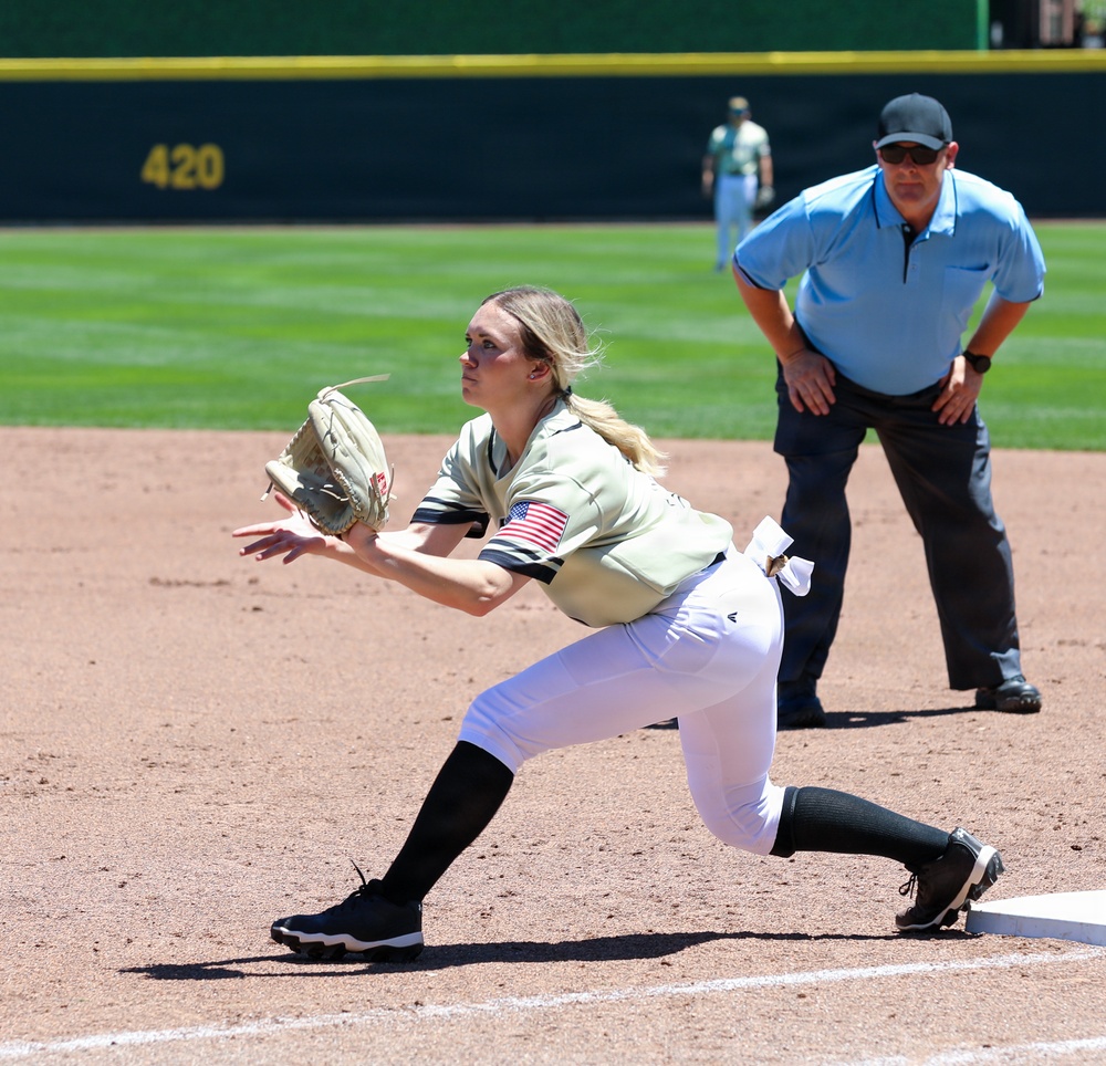 U.S. Military Softball Player Stretches for Catch at First Base During Armed Forces Tournament