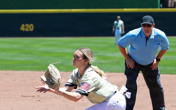 U.S. Military Softball Player Stretches for Catch at First Base During Armed Forces Tournament