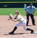 U.S. Military Softball Player Stretches for Catch at First Base During Armed Forces Tournament