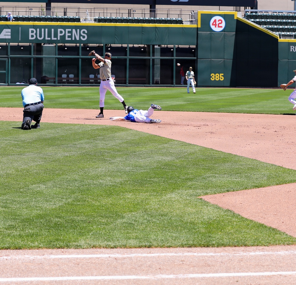 Infielder Fires to First as Runner Slides Into Second Base During Baseball Game