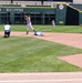 Infielder Fires to First as Runner Slides Into Second Base During Baseball Game