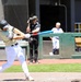 Batter swings patriotic red, white and blue bat during military appreciation baseball game