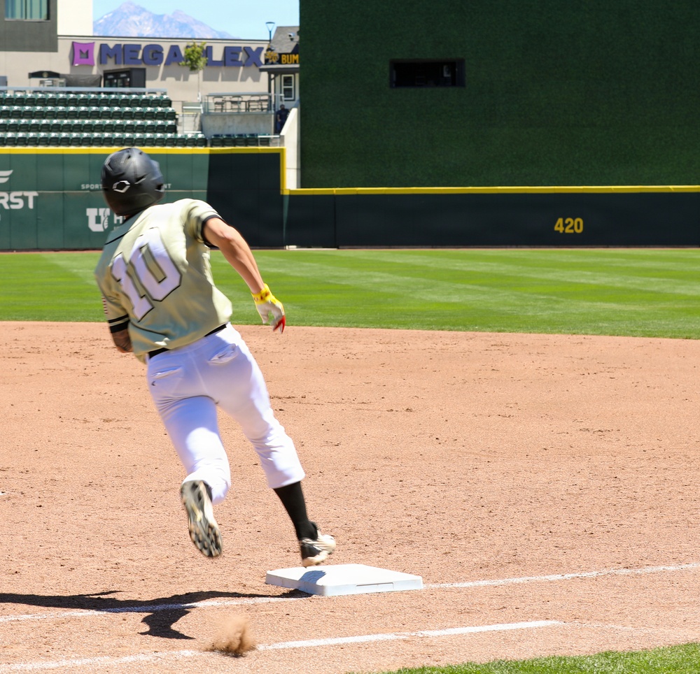 Baseball player No. 10 rounds third base at Smith's Ballpark in Salt Lake City