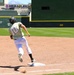 Baseball player No. 10 rounds third base at Smith's Ballpark in Salt Lake City