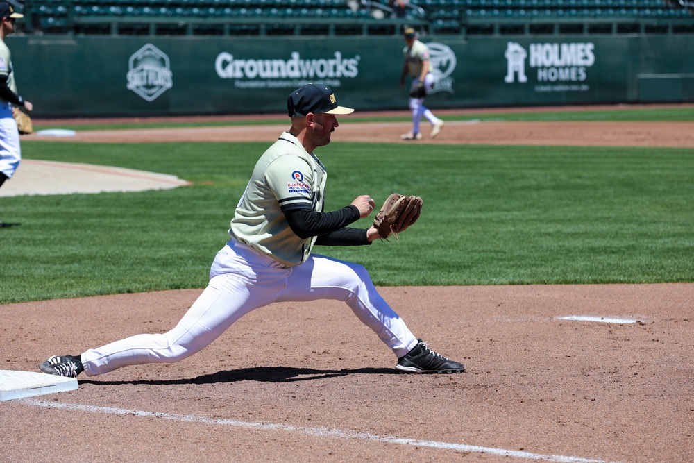 First Baseman Stretches for Throw During Minor League Baseball Game