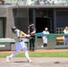 Batter connects during baseball game at professional stadium