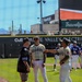 Guards players interact with civilian guest during pre-game ceremonies at Cache Valley Electric ballpark