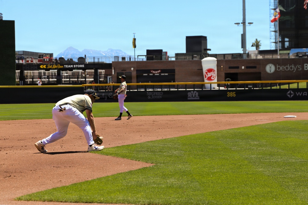 Salt Lake Bees infielder fields ground ball during home game at Smith's Ballpark