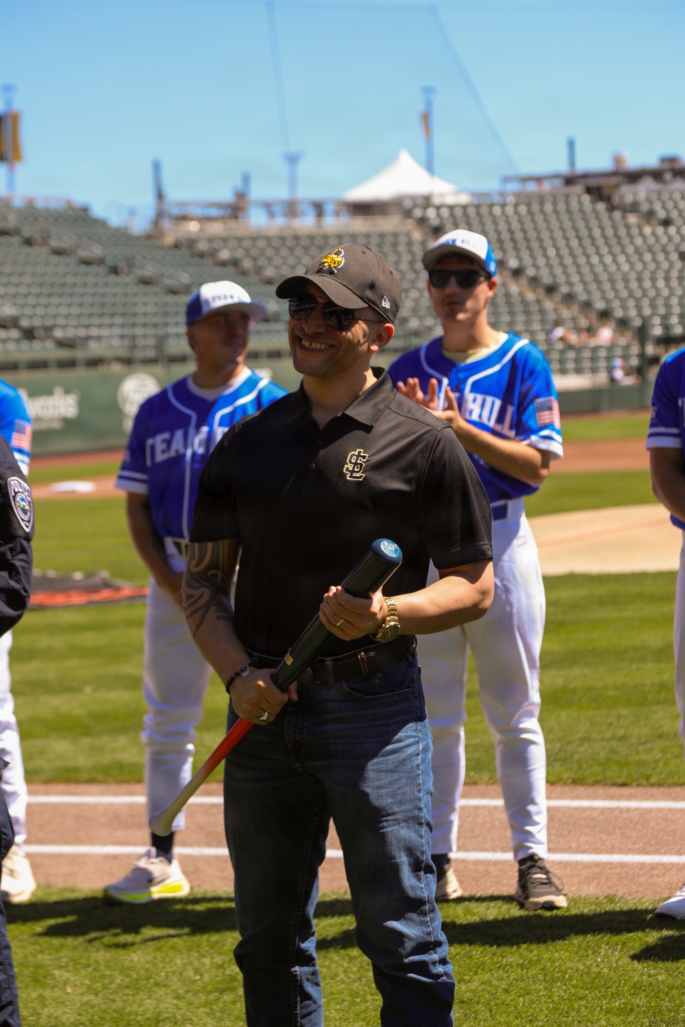 Military-Connected Individual Participates in Baseball Ceremonial Event at Professional Stadium