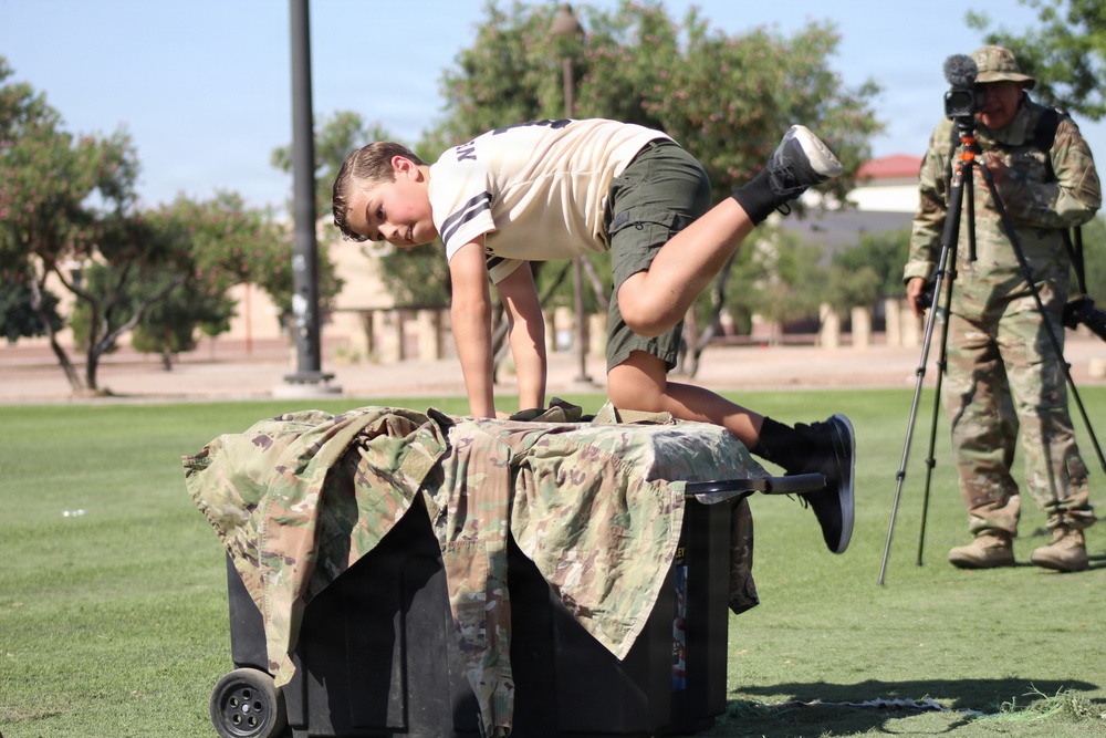 Leaping into Action: Kids conquer obstacle course at Junior Redleg Day