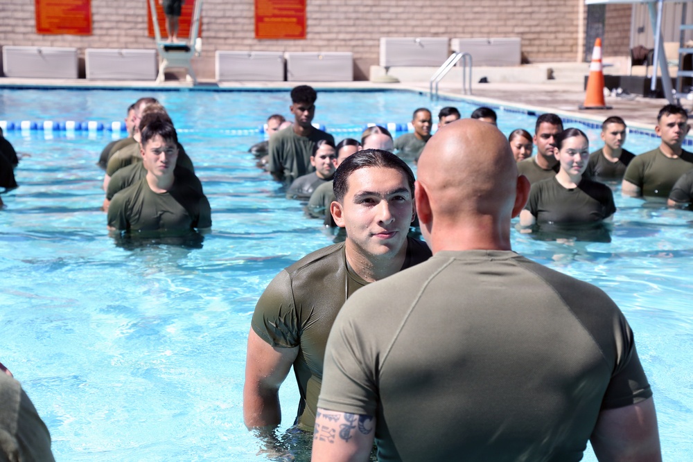 U.S. Marine Corps Sgt. Jorge D. Bosquez and Cpl. Angel F. Cazares reenlist