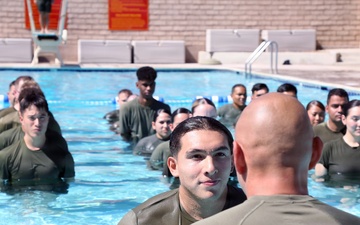 U.S. Marine Corps Sgt. Jorge D. Bosquez and Cpl. Angel F. Cazares reenlist