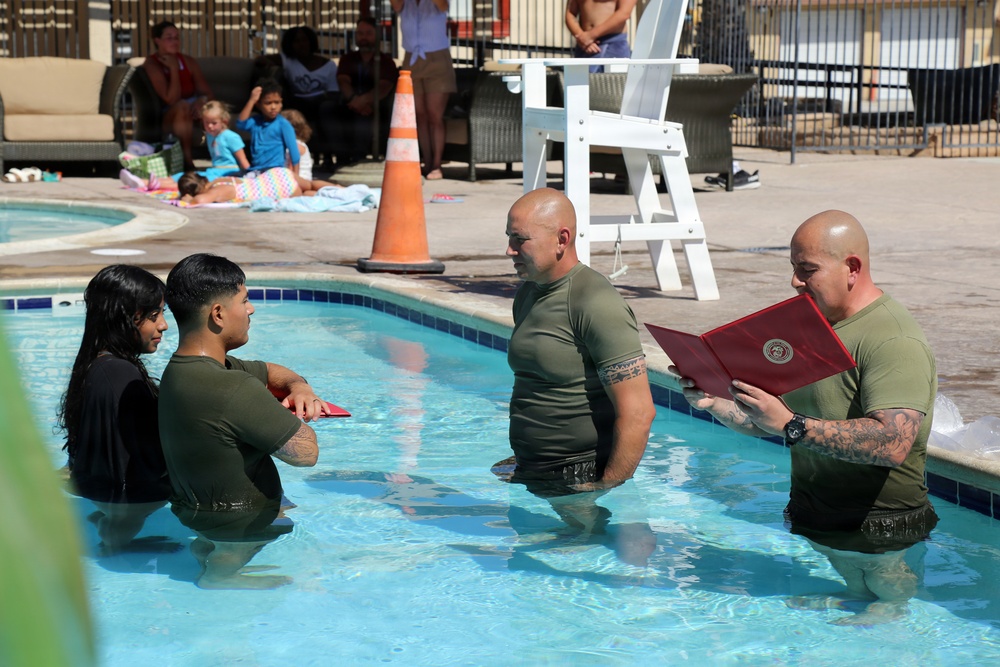 U.S. Marine Corps Sgt. Jorge D. Bosquez and Cpl. Angel F. Cazares reenlist