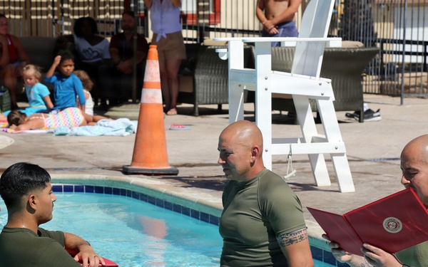 U.S. Marine Corps Sgt. Jorge D. Bosquez and Cpl. Angel F. Cazares reenlist