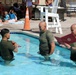 U.S. Marine Corps Sgt. Jorge D. Bosquez and Cpl. Angel F. Cazares reenlist