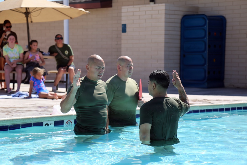 U.S. Marine Corps Sgt. Jorge D. Bosquez and Cpl. Angel F. Cazares reenlist